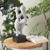 Picture of GRAY SCULPTURE OF CROUCHING PERSON